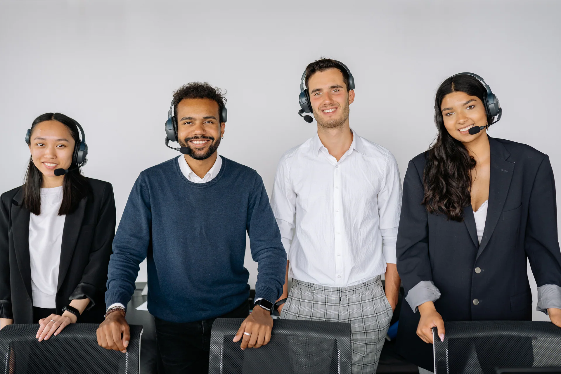Diverse call center team standing together in an office
